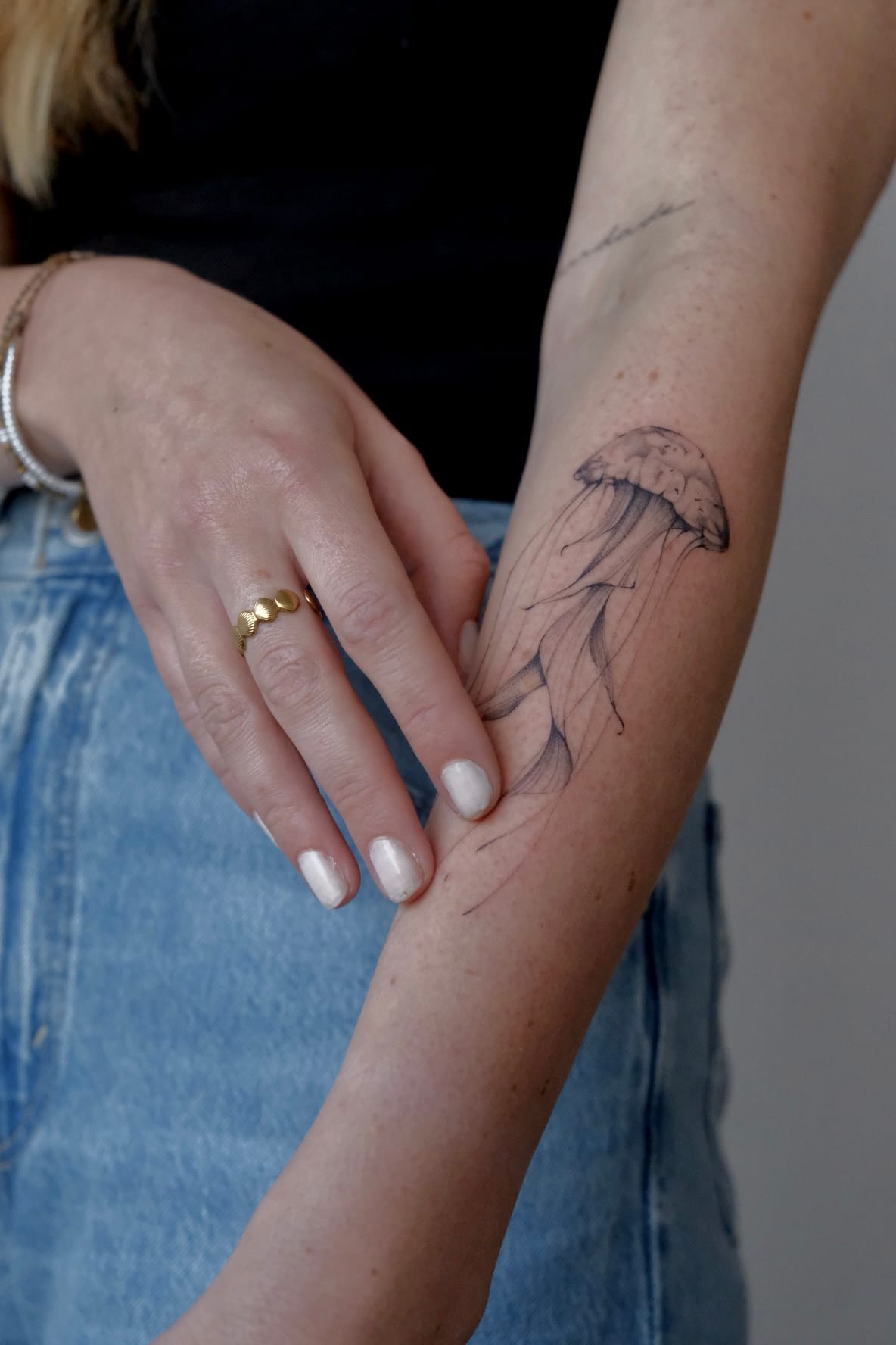 Fine line leaves along the forearm